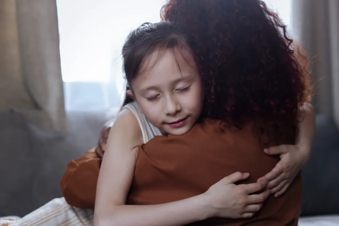 A parent embracing a child, healing through connection and love
